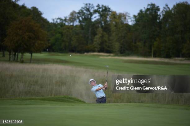 Team Great Britain and Ireland player Jack Murphy gets out of the bunker on the 18th hole on Day Two of the The Jacques Leglise Trophy at Golf de...