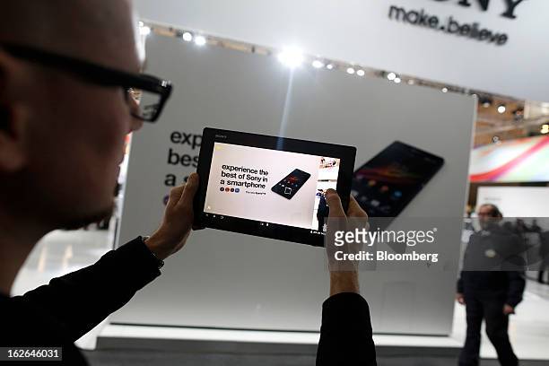 An employee demonstrates the video function of a Sony Corp. Xperia Z tablet at the Mobile World Congress in Barcelona, Spain, on Monday, Feb. 25,...
