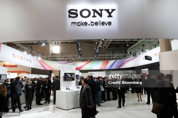 Visitors pass the Sony Corp. Pavilion at the Mobile World Congress in Barcelona, Spain, on Monday, Feb. 25, 2013. The Mobile World Congress, where...