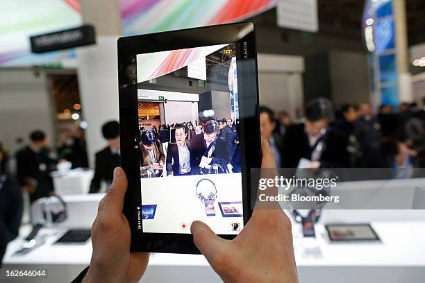 An employee demonstrates the video function of a Sony Corp. Xperia Z tablet at the Mobile World Congress in Barcelona, Spain, on Monday, Feb. 25,...