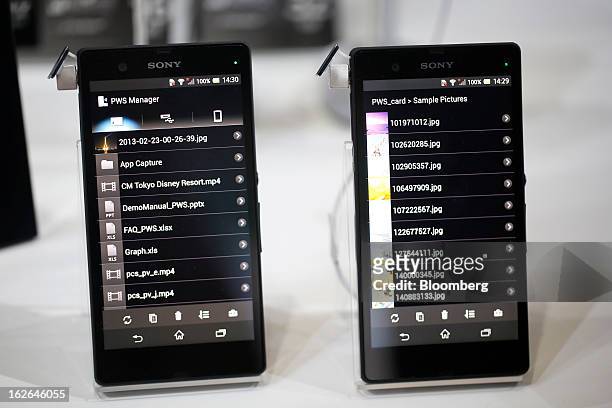 The operating screens of Sony Corp. Xperia Z smartphones are displayed on a stand at the Mobile World Congress in Barcelona, Spain, on Monday, Feb....