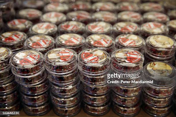 Containers holding Rosary beads with images of Pope Benedict XVI are sold on February 25, 2013 in Rome, Italy. The Pontiff will hold his last weekly...