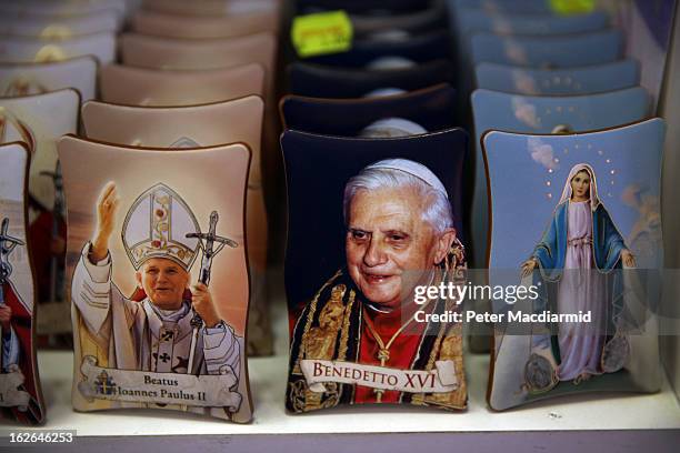 Souvenir photographs of Pope John Paul II , Pope Benedict XVI and The Virgin Mary are displayed for sale on February 25, 2013 in Rome, Italy. The...