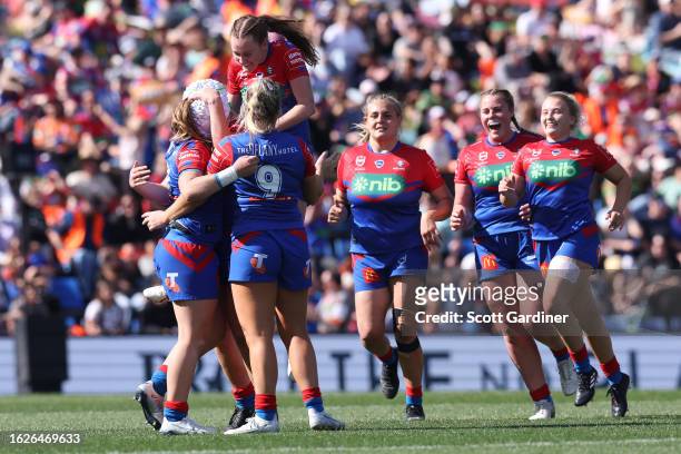 Knights players celebrate the teams win during the round five NRLW match between Newcastle Knights and Brisbane Broncos at McDonald Jones Stadium, on...