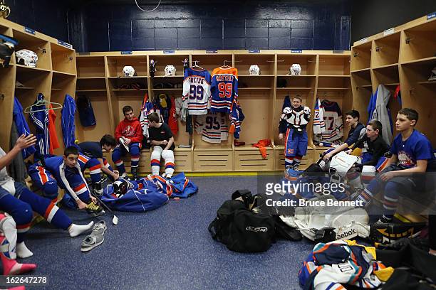 Gretzky jerseys hang in lockers as youth players get prepared for an appearance by Hockey Hall of Famer Wayne Gretzky at the Abe Stark Arena on...