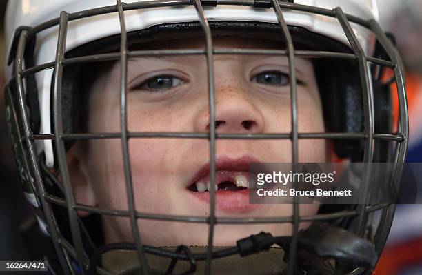 Youth player Jonathan Beale, age 7, waits to get on the ice during an appearance by Hockey Hall of Famer Wayne Gretzky at the Abe Stark Arena on...