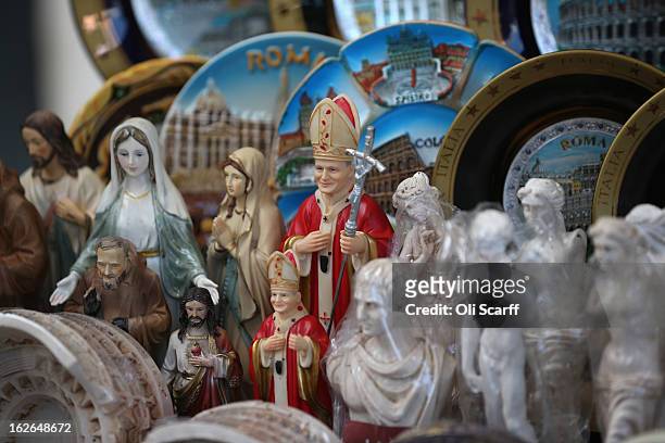 Souvenir statues depicting the Pope are displayed for sale on February 25, 2013 in Rome, Italy. The Pontiff will hold his last weekly public audience...