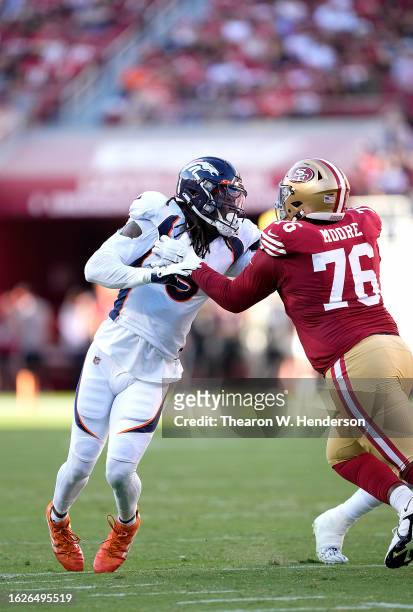 Randy Gregory of the Denver Broncos rushes up against Jaylon Moore of the San Francisco 49ers during the second quarter of a preseason game at Levi's...