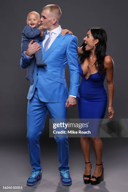 Ian Garry of Ireland poses for a portrait with his family after his victory during the UFC 292 event at TD Garden on August 19, 2023 in Boston,...