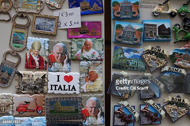 Souvenir magnets, some depicting Pope John Paull II, are displayed for sale on February 25, 2013 in Rome, Italy. The Pontiff will hold his last...