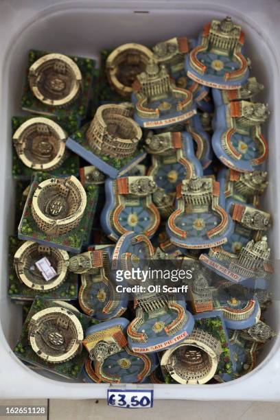 Models of Saint Peter's Square in the Vatican and Rome's Colosseum are displayed for sale on February 25, 2013 in Rome, Italy. The Pontiff will hold...