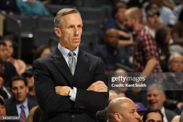 Mike Dunlap of the Charlotte Bobcats stands on the sideline during the game against the Atlanta Hawks at the Time Warner Cable Arena on January 23,...