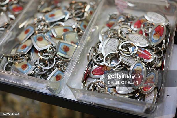 Selection of keyrings bearing the image of the Pope Benedict XVI are displayed for sale on February 25, 2013 in Rome, Italy. The Pontiff will hold...