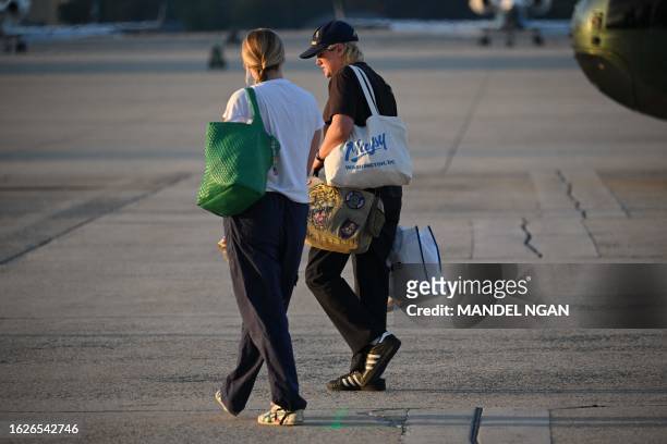 President Joe Biden's grand daughters Finnegan Biden and Maisy Biden walk on the tarmac upon arrival at Andrews Air Force Base in Maryland on August...