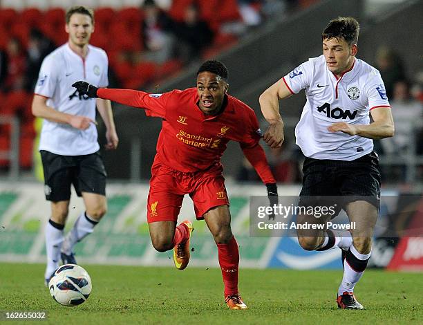 Raheem Sterling of Liverpool competes with Frederic Veseli of Manchester United Reserves during the Barclays Premier Reserve League match between...