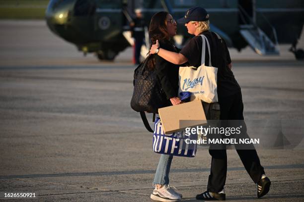 President Joe Biden's daughter Ashley Biden is hugged Maisy Biden upon arrival at Andrews Air Force Base in Maryland on August 26, 2023. Biden...