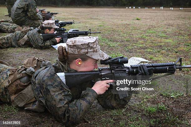 Female Marine recruits fire on the rifle range during boot camp February 25, 2013 at MCRD Parris Island, South Carolina. All female enlisted Marines...