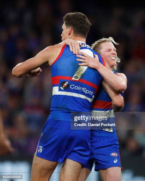 Rory Lobb of the Bulldogs celebrates with Cody Weightman of the Bulldogs after kicking a goal during the round 23 AFL match between Western Bulldogs...