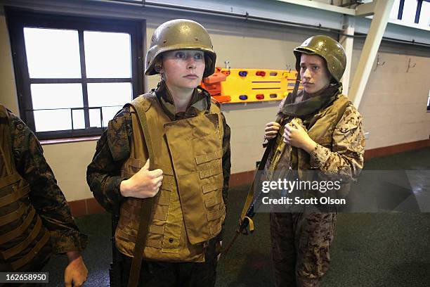 Female Marine recruits Kara Forrestor of Great Falls, Montana and Savannah Warren of Deer Park, Washington prepare to jump in the pool wearing body...