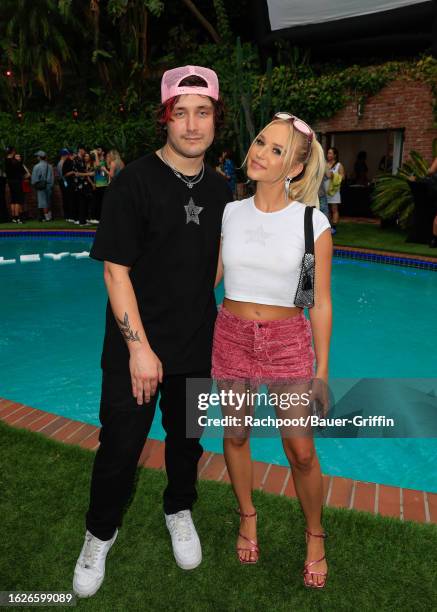 Kyle Hulett and Cortney van Olphen attend the Valley Brat Summer Pool Party at a private residence on August 19, 2023 in Los Angeles, California.