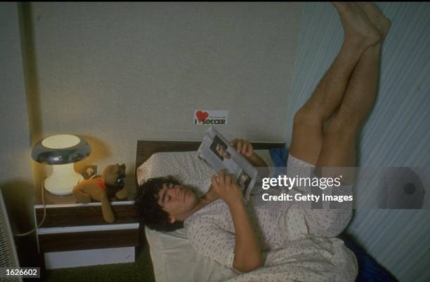 Diego Maradona of Argentina resting on his bed with his feet up at home. \ Mandatory Credit: Allsport UK /Allsport