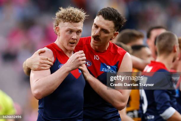 Jake Lever of the Demons drags team mate Clayton Oliver of the Demons away from a wrestle during the round 23 AFL match between Melbourne Demons and...