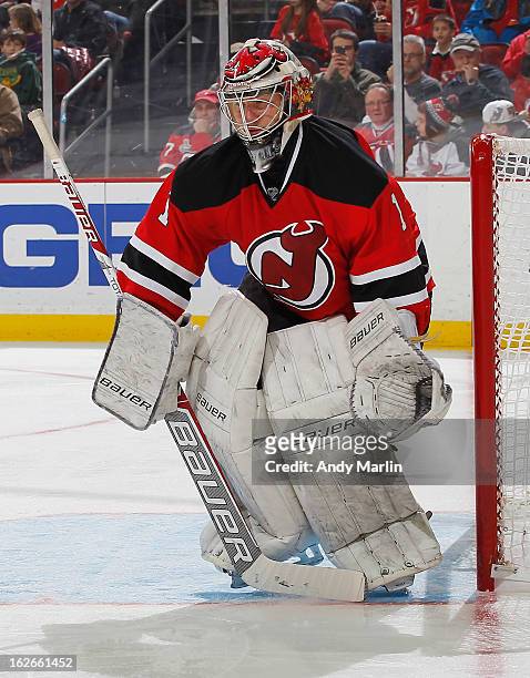 Johan Hedberg of the New Jersey Devils defends his net against the Winnipeg Jets during the game at the Prudential Center on February 24, 2013 in...