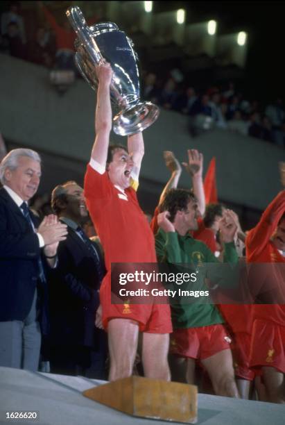 Phil Thompson captain of Liverpoool victoriously raises the European Cup after the final between Liverpool and Real Madrid in Paris. Liverpool won...