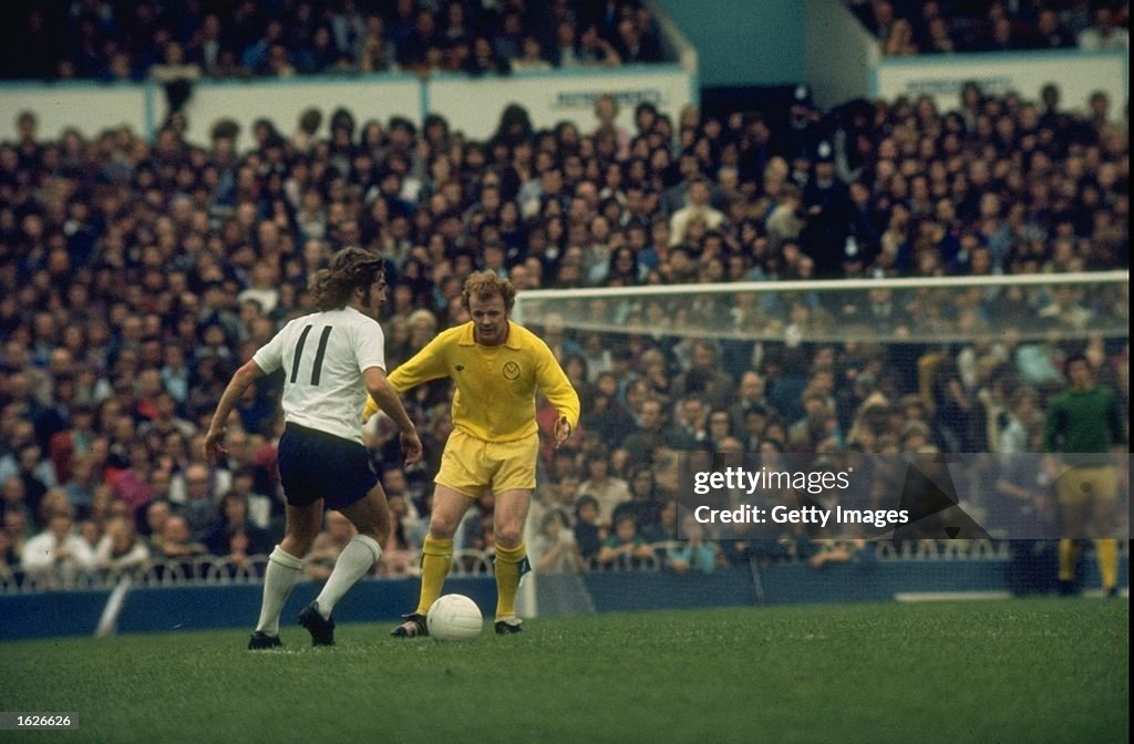 Billy Bremner of Leeds takes the ball away from the #11 in a League match