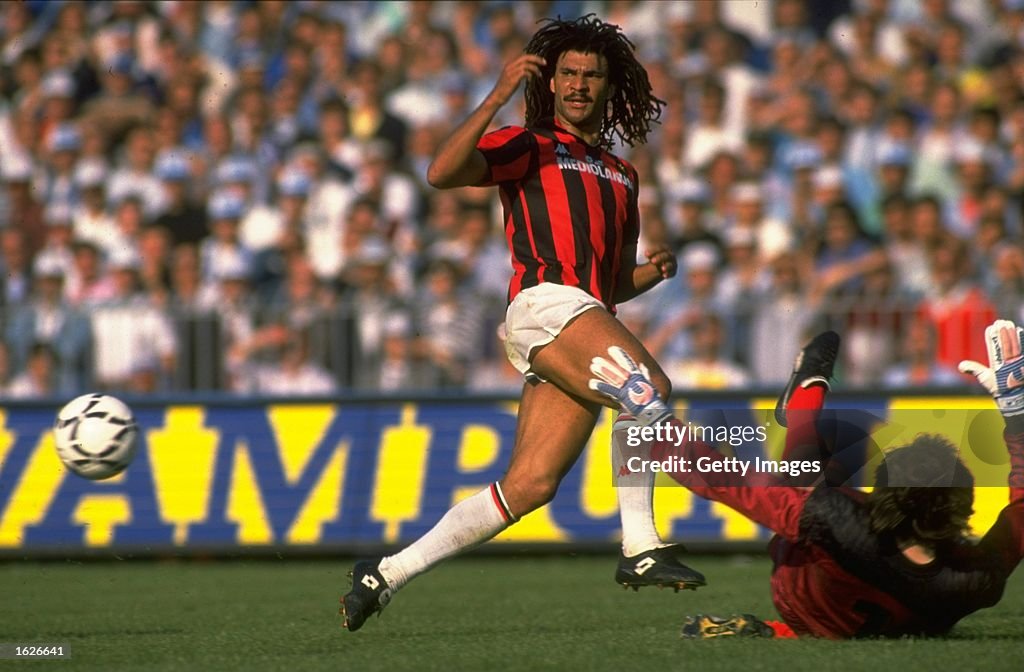 Ruud Gullit of AC Milan races to intercept the ball