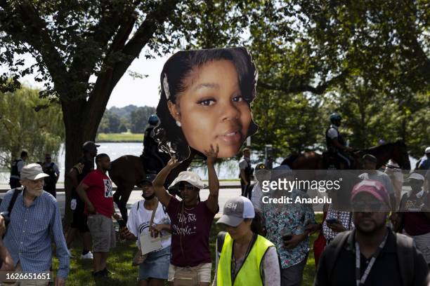 Demonstrators hold banners on the 60th anniversary of the March On Washington and Martin Luther King Jr's historic 'I Have a Dream' speech at the...