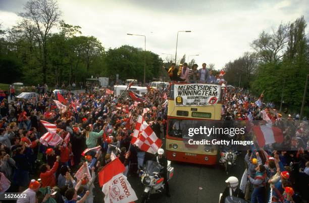 General view of the Liverpool team bus surrounded by supporters during their homecoming after their victory in the the FA Cup final against Everton...