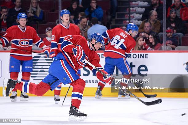 Tomas Kaberle of the Montreal Canadiens shoots the puck during the the warm up period prior to facing the New York Rangers in their NHL game at the...