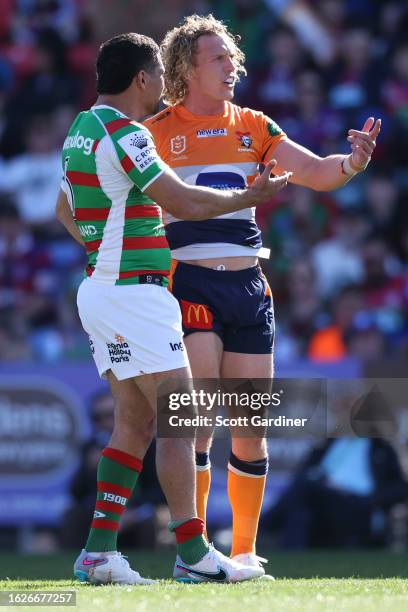 Phoenix Crossland of the Knights and Cody Walker of the Rabbitohs react to the score board during the round 25 NRL match between Newcastle Knights...