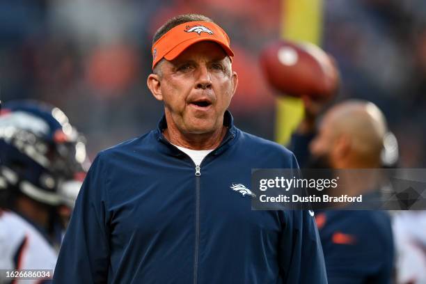 Head coach Sean Payton of the Denver Broncos walks on the field before a preseason game against the Los Angeles Rams at Empower Field at Mile High on...