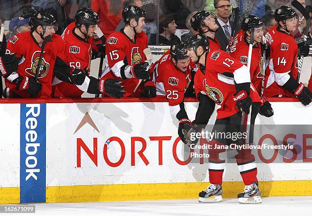 Peter Regin of the Ottawa Senators celebrates his game winning shootout goal with team mates Jim O'Brien, David Dziurzynski, Zack Smith, and Chris...