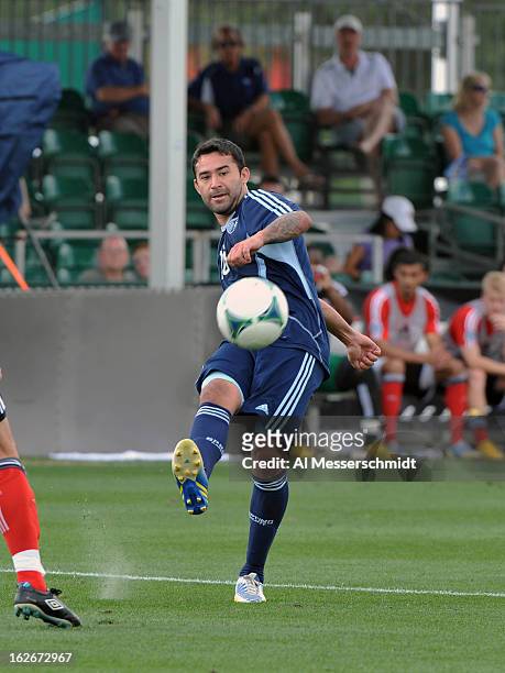 Forward Claudio Bieler of Sporting Kansas City kicks the ball upfield against the Toronto FC February 23, 2013 in the final round of the Disney Pro...