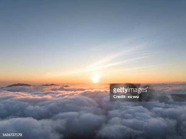 aerial photography of sunrise over clouds - cloudscape stock pictures, royalty-free photos & images