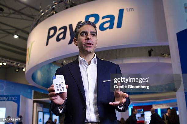 David Marcus, president of PayPal Inc. Poses for a photograph with a new chip-and-pin payment device for small businesses at the Mobile World...