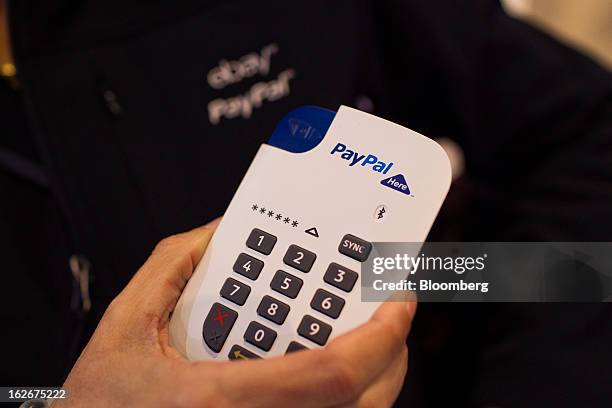 PayPal Inc.'s new chip-and-pin payment device for small businesses is arranged for a photograph at the Mobile World Congress in Barcelona, Spain, on...