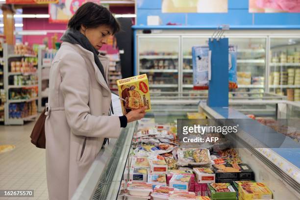 Agent conducts a verification of the withdrawal of frozen products containing horse meat in Herouville Saint-Clair, northwestern France, on February...