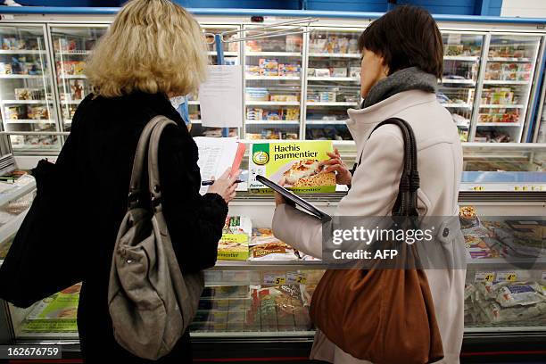 Agents conduct a verification of the withdrawal of frozen products containing horse meat in Herouville Saint-Clair, northwestern France, on February...