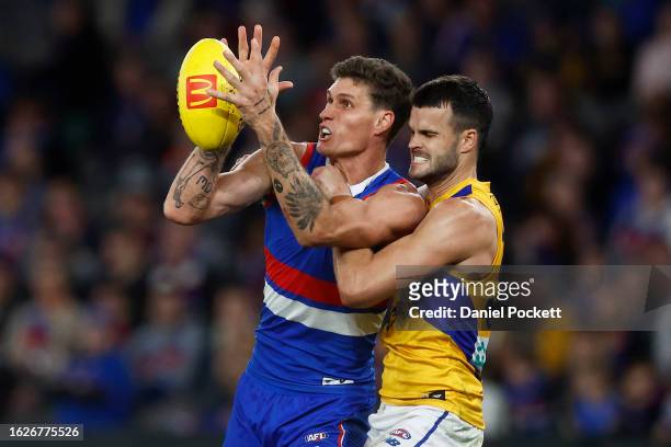 Rory Lobb of the Bulldogs marks the ball under pressure from Josh Rotham of the Eagles and Tom Cole of the Eagles during the round 23 AFL match...