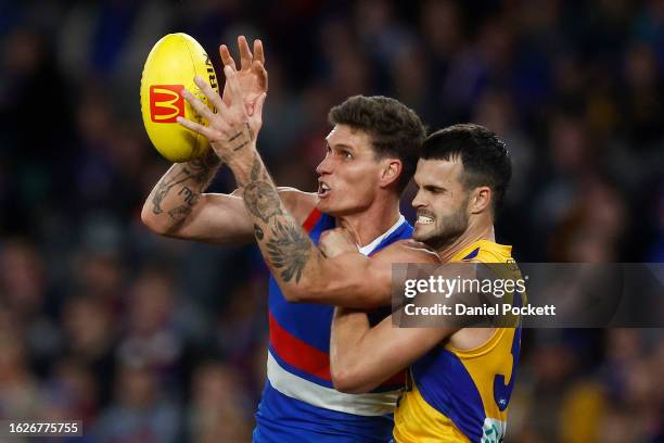 Rory Lobb of the Bulldogs marks the ball under pressure from Josh Rotham of the Eagles and Tom Cole of the Eagles during the round 23 AFL match...