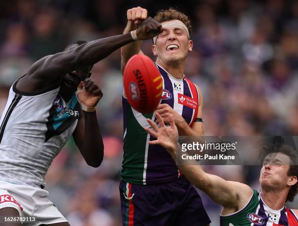 Aliir Aliir of the Power and Tom Emmett of the Dockers contest for the ball during the round 23 AFL match between Fremantle Dockers and Port Adelaide...