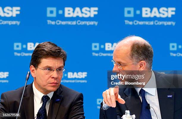 Hans-Ulrich Engel, chief financial officer of BASF SE, left, listens as Kurt Bock, chief executive officer of BASF SE, speaks during a news...