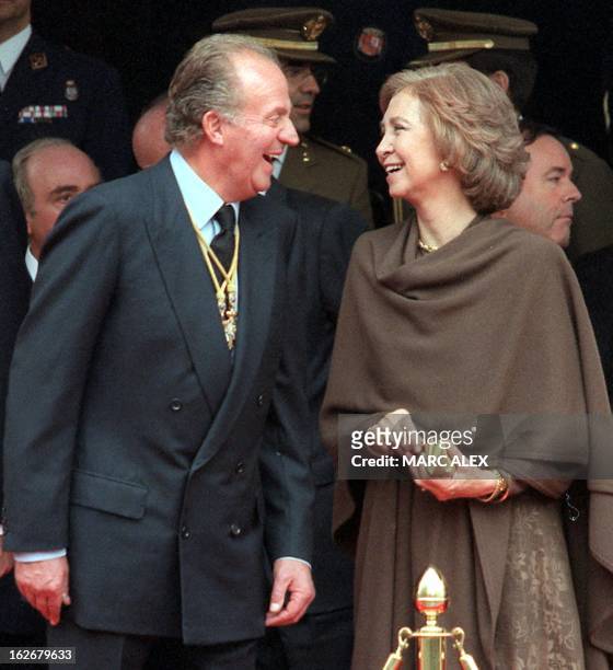 Spanish King Juan Carlos and Queen Sofia share a laugh during a ceremony to commemorate the 25th anniversary of the coronation of King Juan Carlos,...