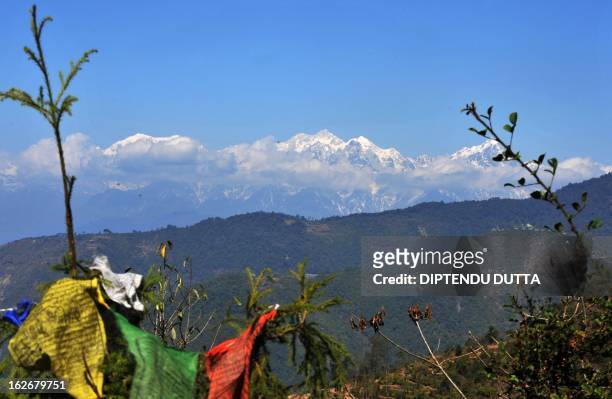 Light from a sunrise is cast on the Indian Kangchenjunga mountain at Ravangla village in South Sikkim on February 25, 2013. Kangchenjunga is the...