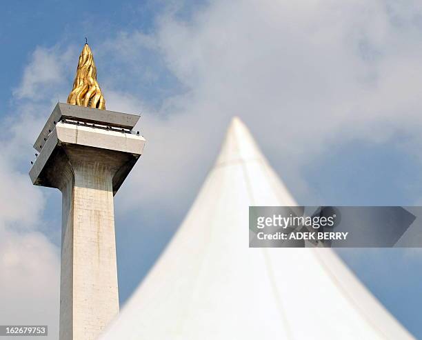 Picture shows the National Monument or Monas with its gold plated flame symbolizing the fight for Indonesia's independence standing 422ft high in...