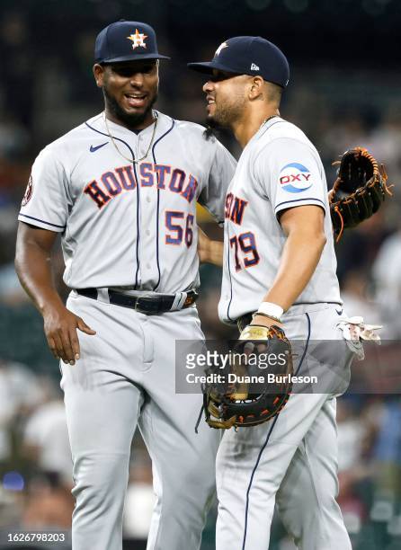 Ronel Blanco and Jose Abreu of the Houston Astros celebrate a 9-2 win over the Detroit Tigers at Comerica Park on August 26, 2023 in Detroit,...